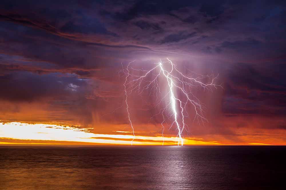 Sunset-lit lightning over Gulf St Vincent, South Australia, 21 January 2018—Rowland Beardsell