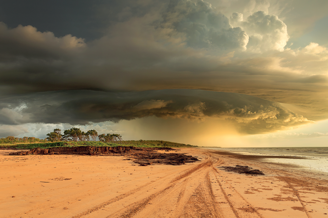 Large storm cloud in the sky over an empty beach