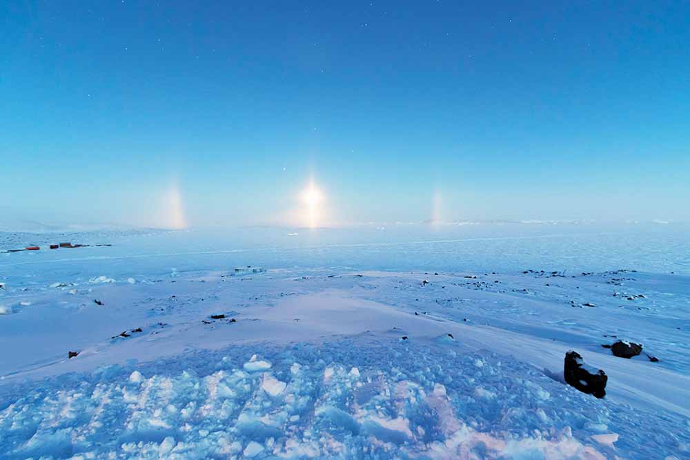 Diamond dust, partial 22° halo and light pillar over Prydz Bay, Davis Research Station, Antarctica
