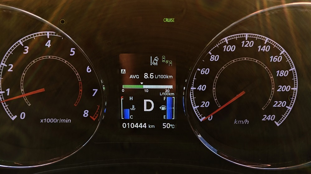 Car dashboard showing outside temperature as 50 °C.