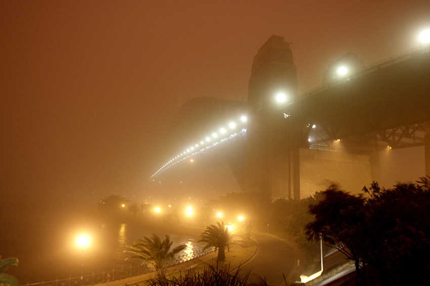 Sydney Harbour Bridge during Red Dawn, 5.32 am 23 September 2009. Credit: John Grainger