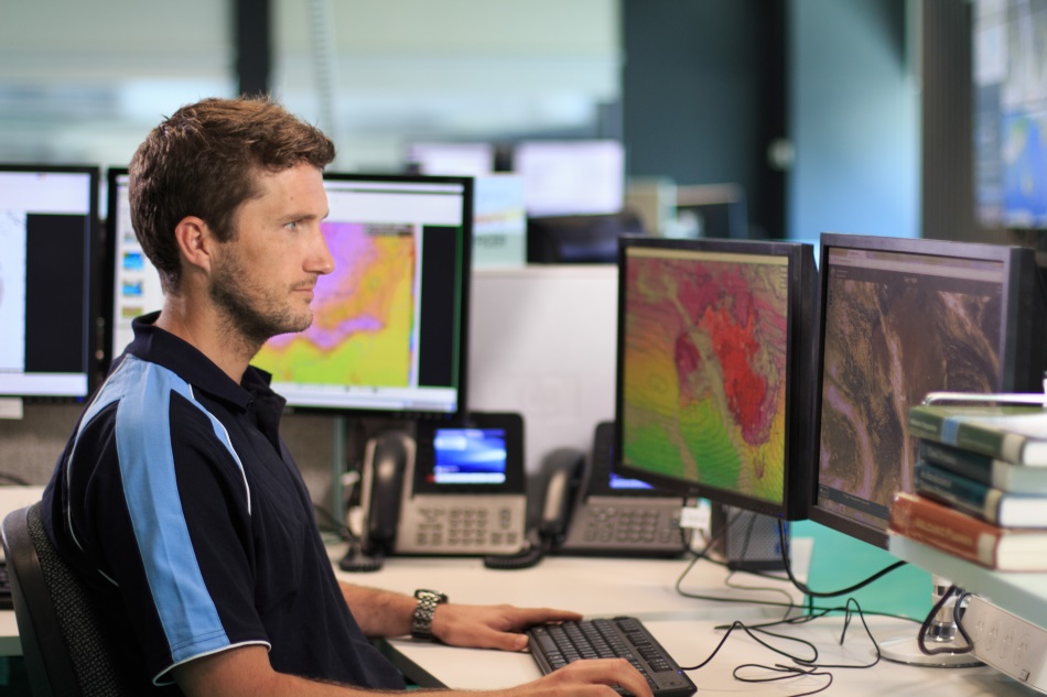 Image: A meteorologist at the Bureau's National Operations Centre