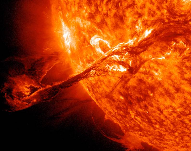 A solar filament structure many times the size of Earth erupts following a solar flare, carrying magnetised plasma into space.
